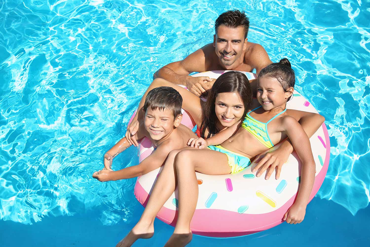 Happy Family in the Pool with Build Right Pool Heater